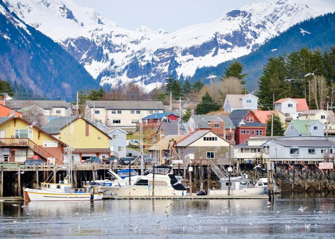Small town in Alaska with snowcapped mountains