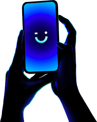 two hands holding phone displaying winking emoji