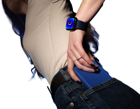 wrist with three smartwatches displaying emojis