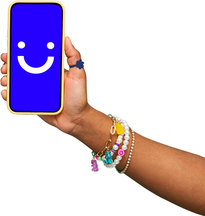 arm wearing colorful bracelets holding a visible phone