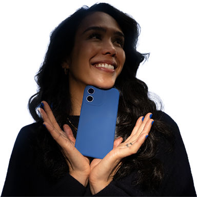 Phone with visible smiley emoji held in front of blue light