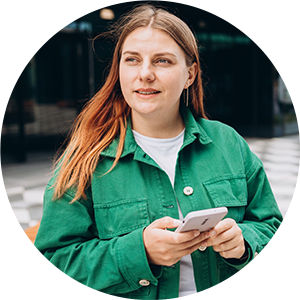 woman standing outside with cell phone