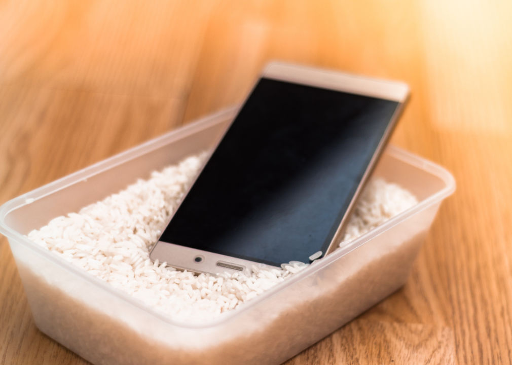 A smartphone in a bowl of rice
