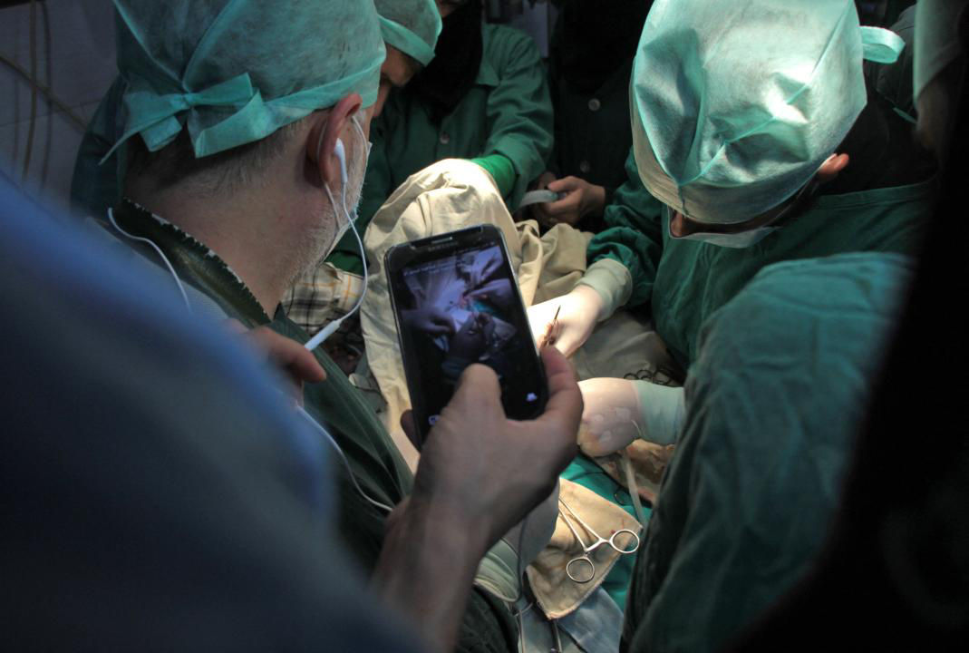 Surgeons using a phone during an operation