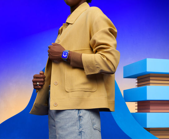 person wearing smartwatch displaying a smile emoji